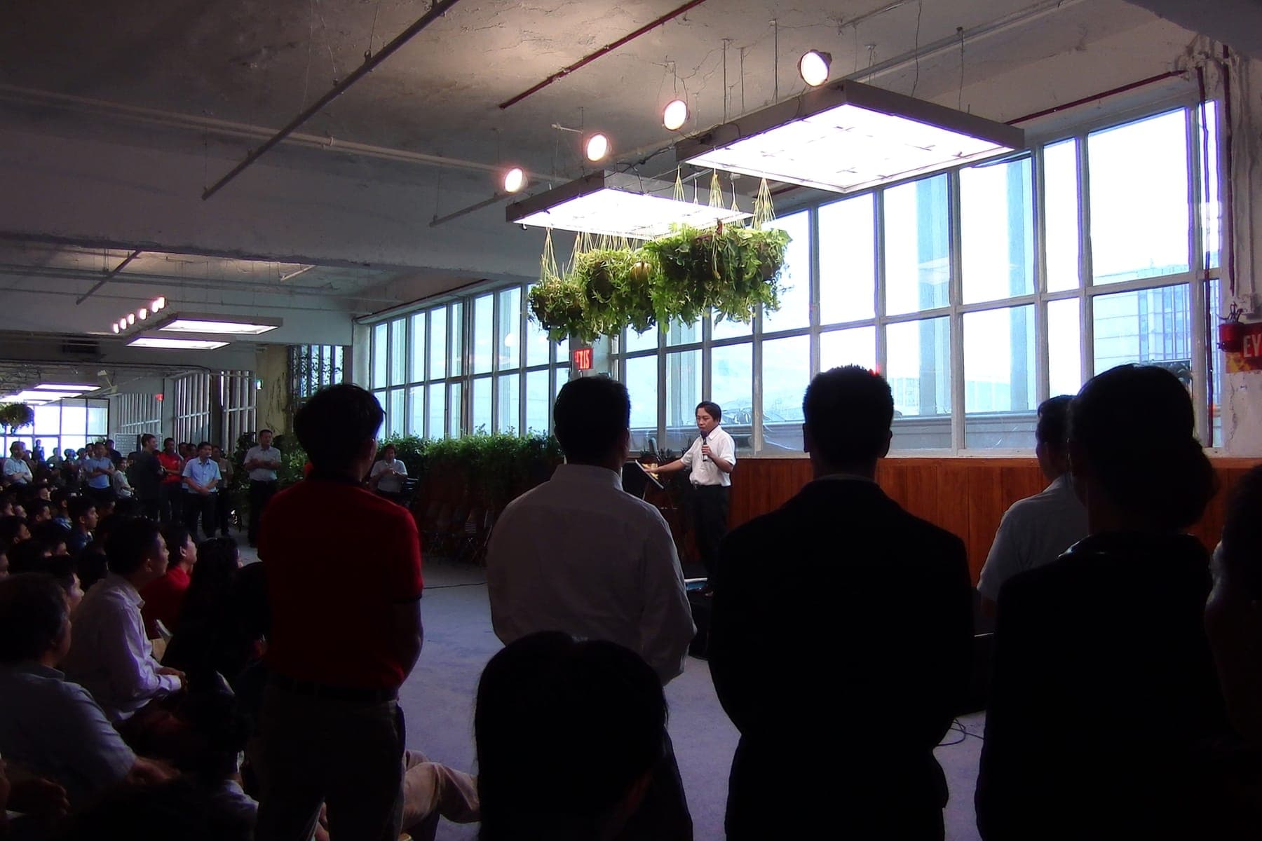 A founder pitching to investors in a loft venue